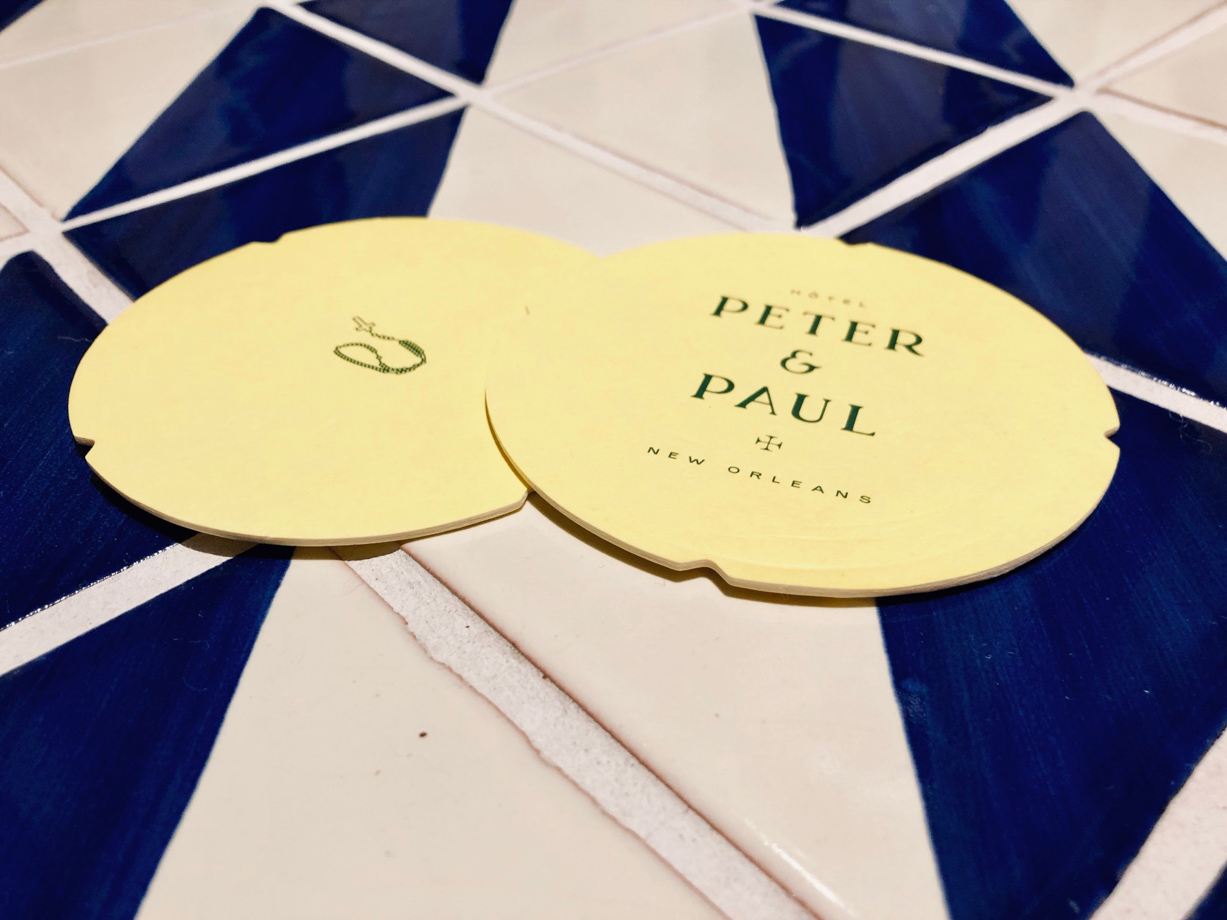 Hotel Peter & Paul Branding details on the punchy yellow coasters.