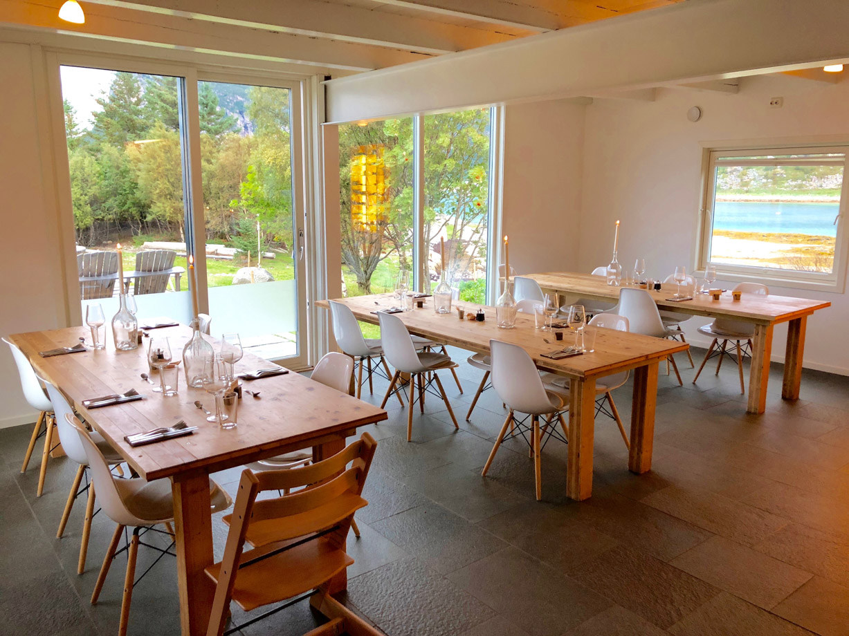 Manshausen Simple, rustic and beautiful – the dining room has a warm, cosy, Scandi feel where everyone on island gathers for delicious, fresh, locally sourced food, cooked by creative chefs in an open kitchen concept.  
