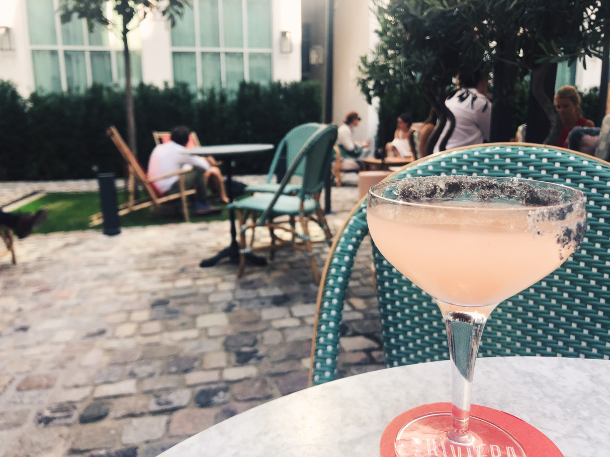 The Hoxton Paris A grapefruit and mezcal cocktail in the lovely courtyard.