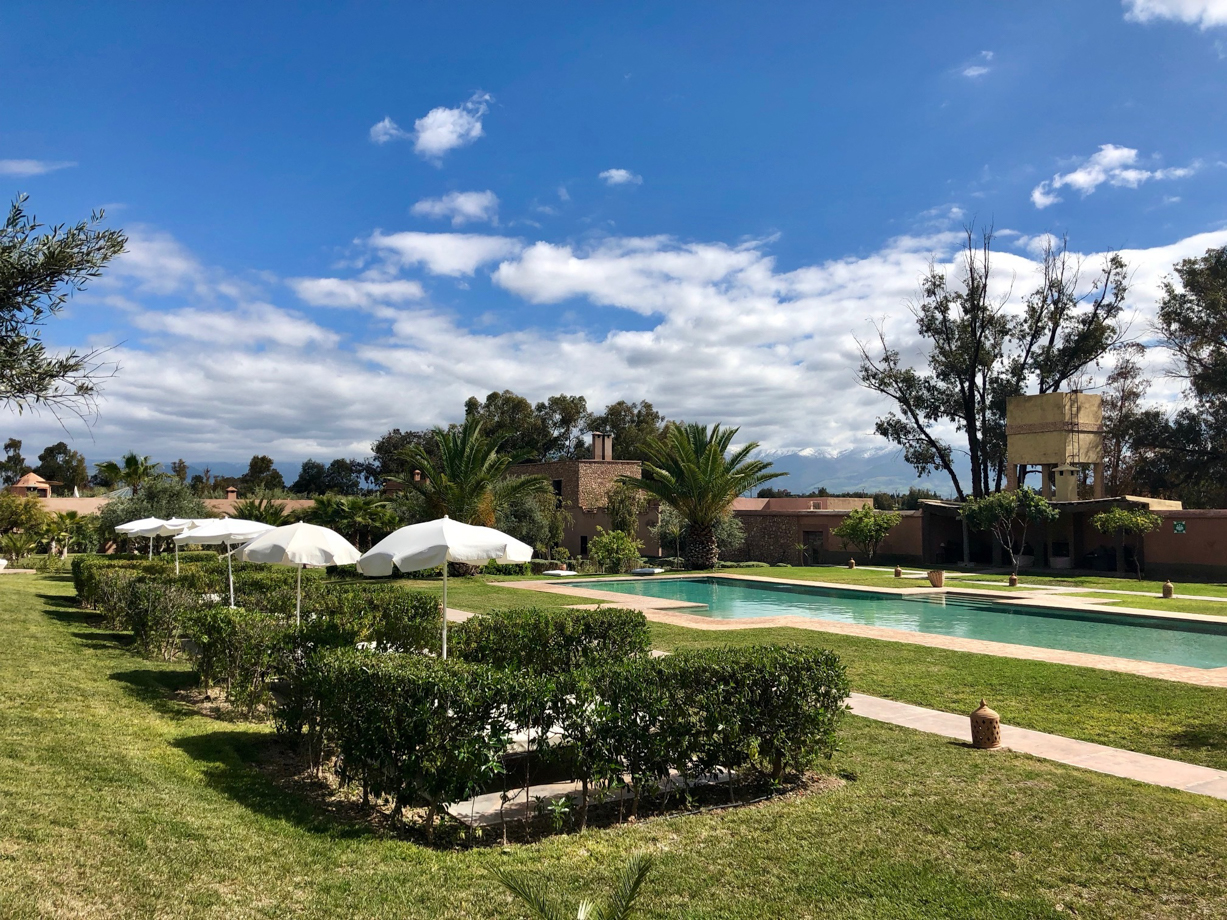 The Capaldi Hotel Private tanning areas line the side of the cold pool.