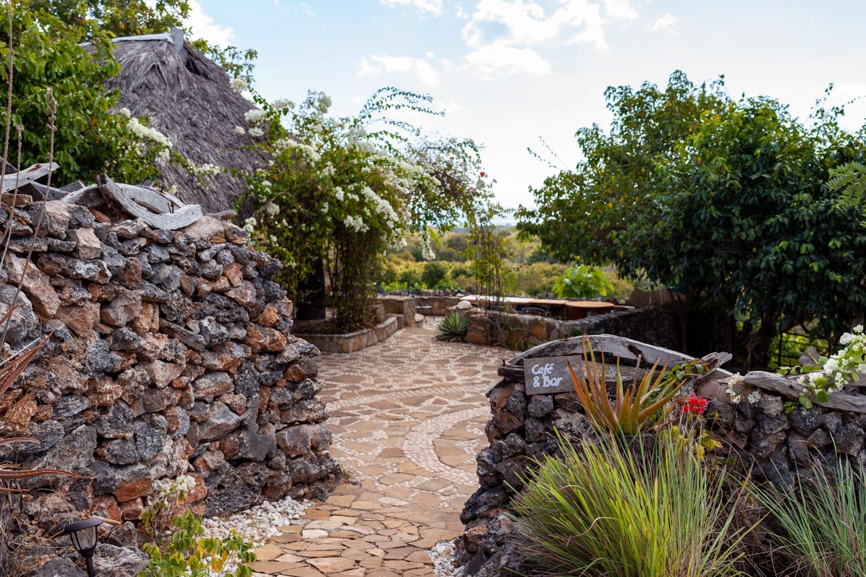 Utopia Entry to the property down the stone paved path towards the main dining area.