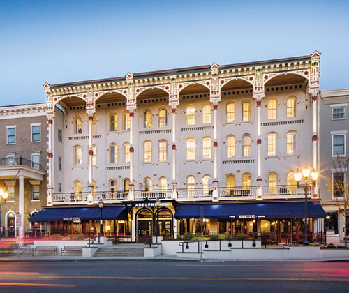 In town on the main drag, has a fantastic bar and beautiful restaurant that's like being transported to a Parisian greenhouse.