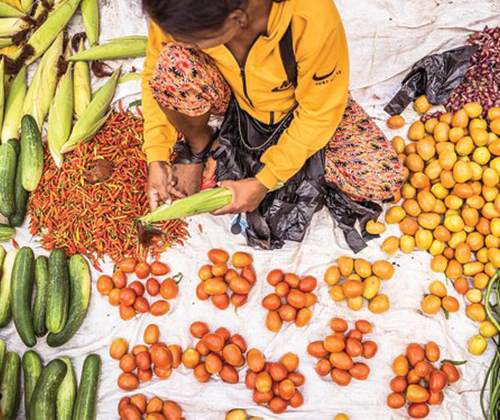 A hub of community activity and maybe the only place to buy fresh produce. They also sell second hand clothes and sugary donuts.