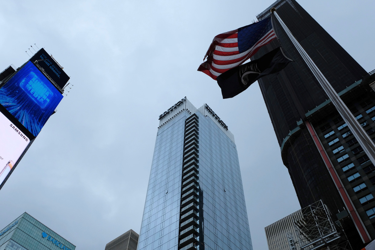 The Times Square EDITION Mighty Edition towering over the city.