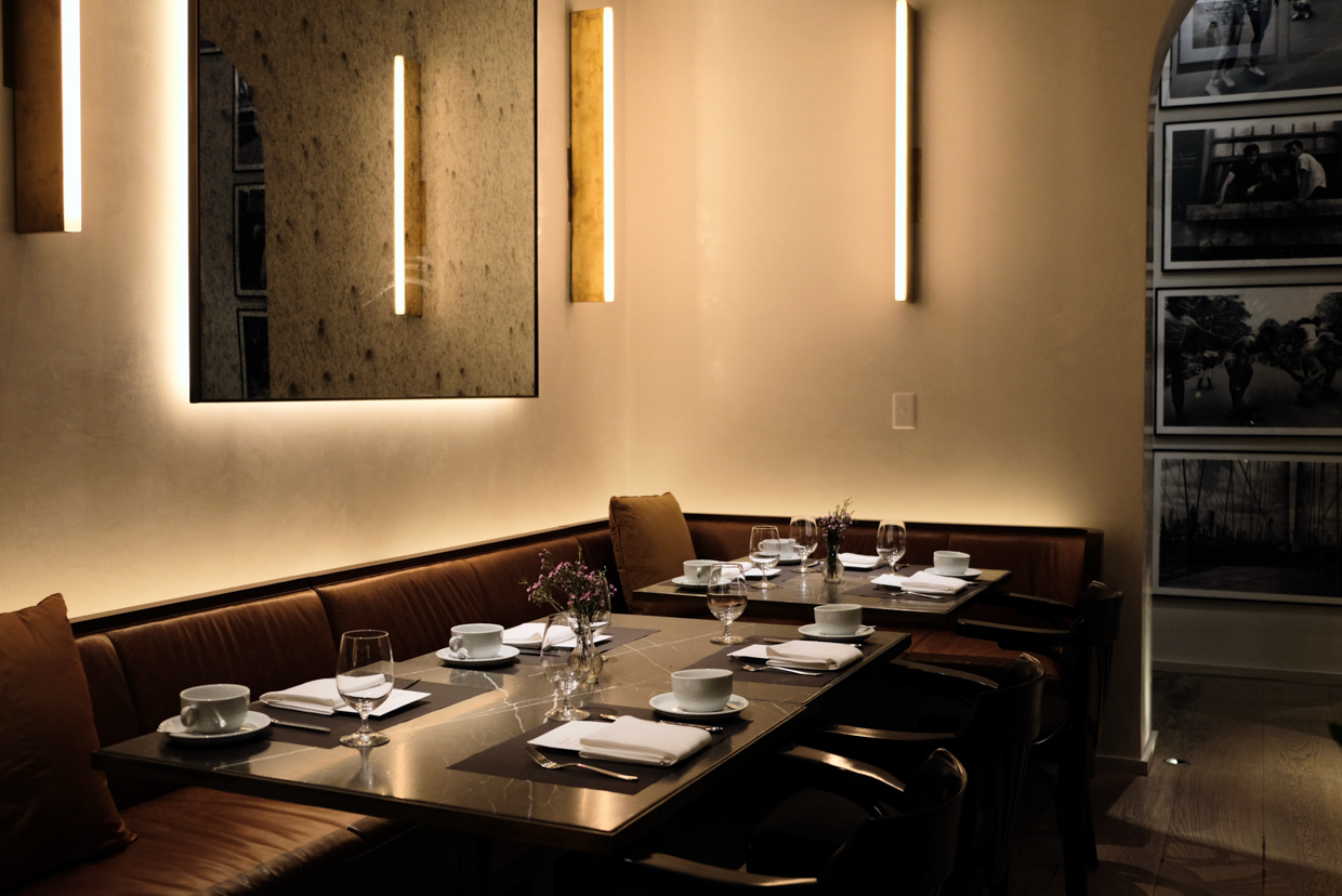 The Times Square EDITION The combination of clean minimal leather booths, copper mid century lamps and marble table tops is exactly what I like to have with my meal. 
