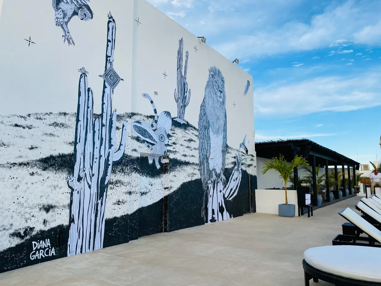 El Ganzo The sun drenched rooftop features a large-scale mural by artist Diana Garcia; serving as a grand reminder of the importance of taking care of our planet and all sentient beings. 
