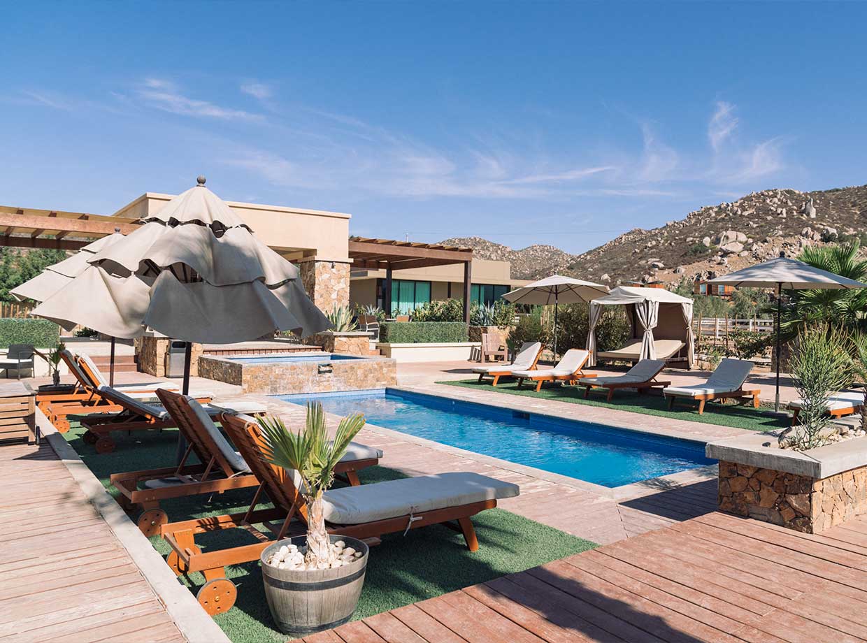 Hotel Boutique Valle De Guadalupe Lounging and wine by the pool? Yes, please.