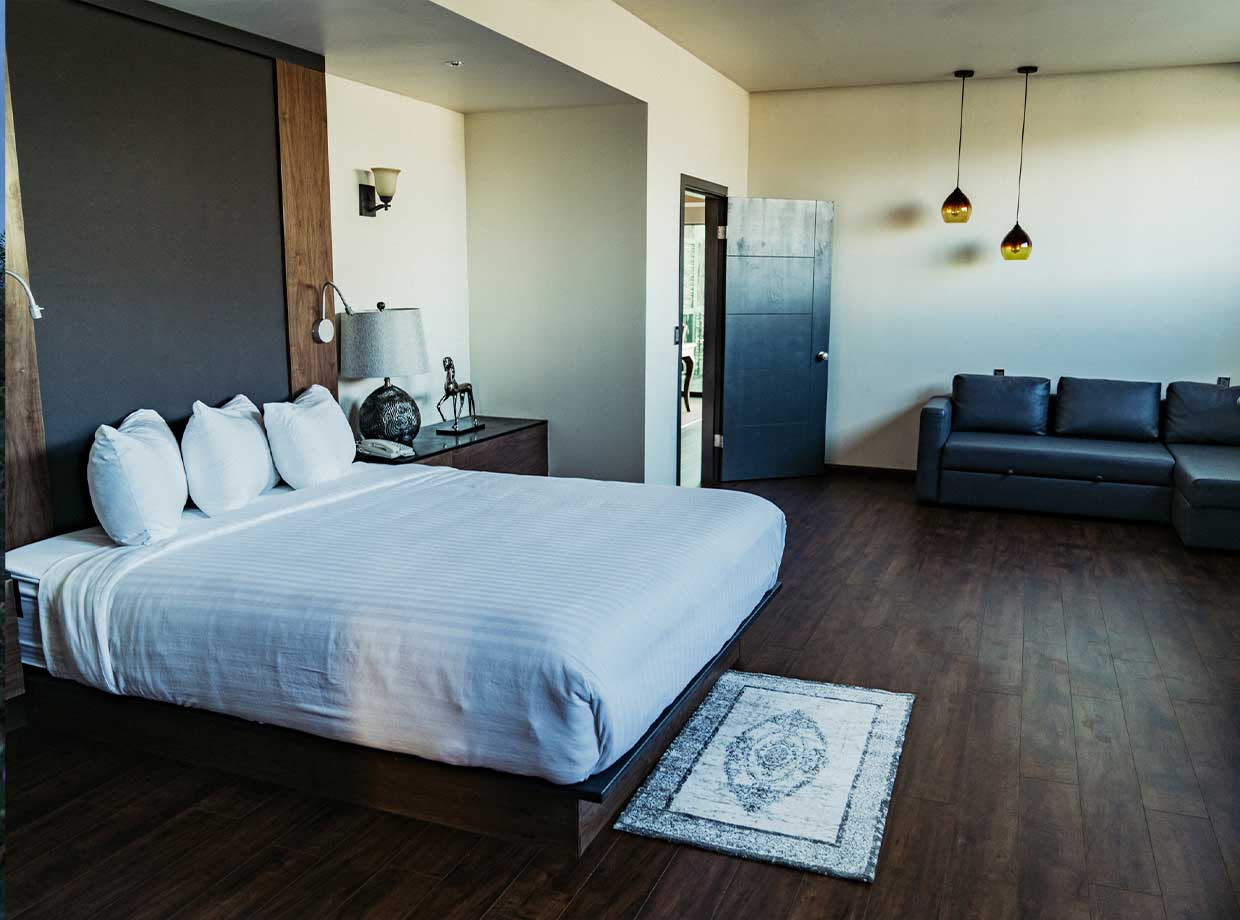 Hotel Boutique Valle De Guadalupe An insanely comfortable king-sized bed and fresh roses await.