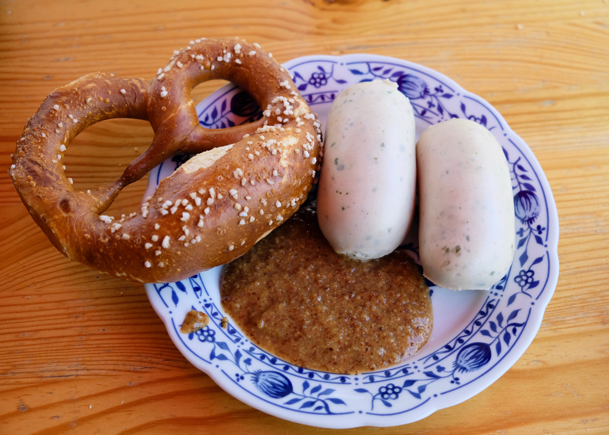 The Flushing Meadows Hotel When in Rome, I mean Bavaria. Weisswurst with a brezel and sweet mustard only served with this dish. Find the best street food at Viktualienmarkt. 
