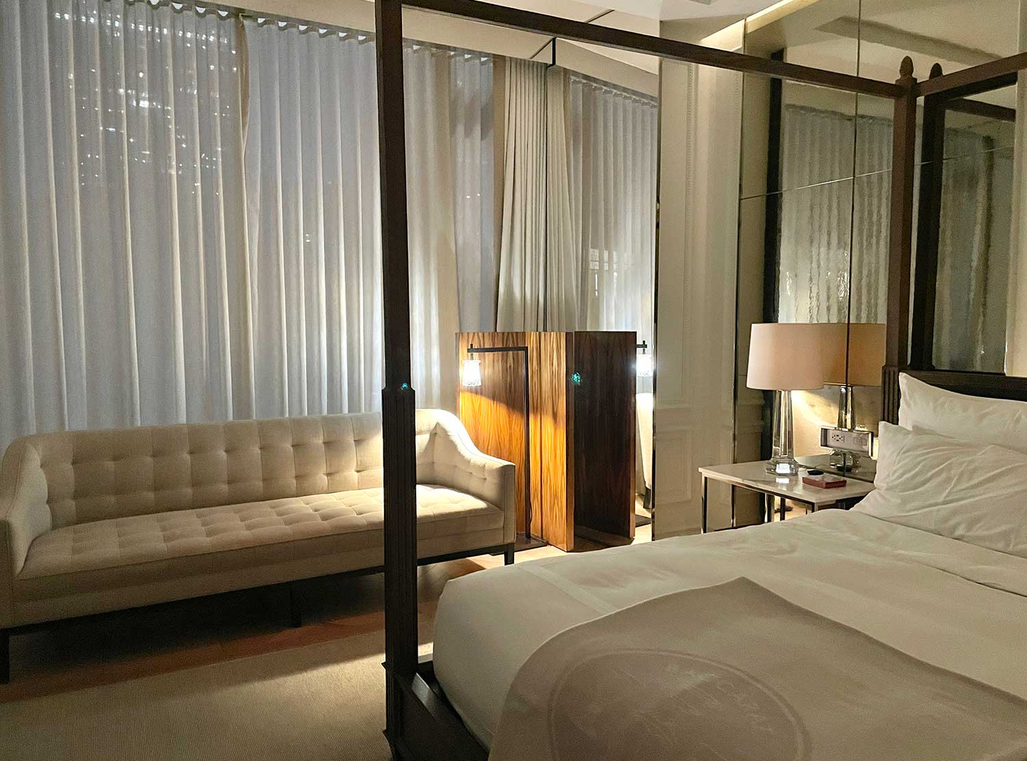 Baccarat Hotel The space perfectly balances warmth with luxury.