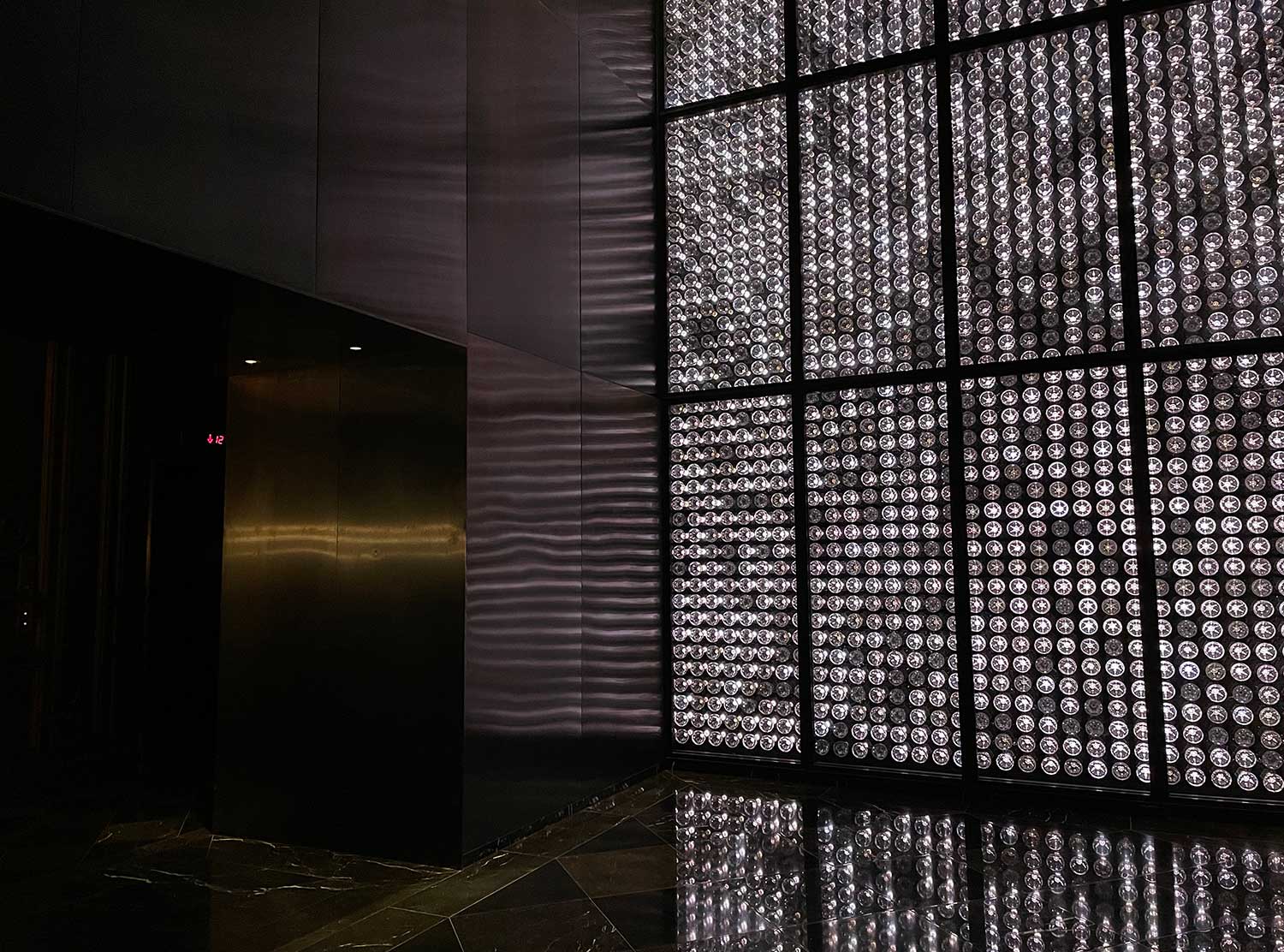 Baccarat Hotel A flickering light installation welcomes guests.