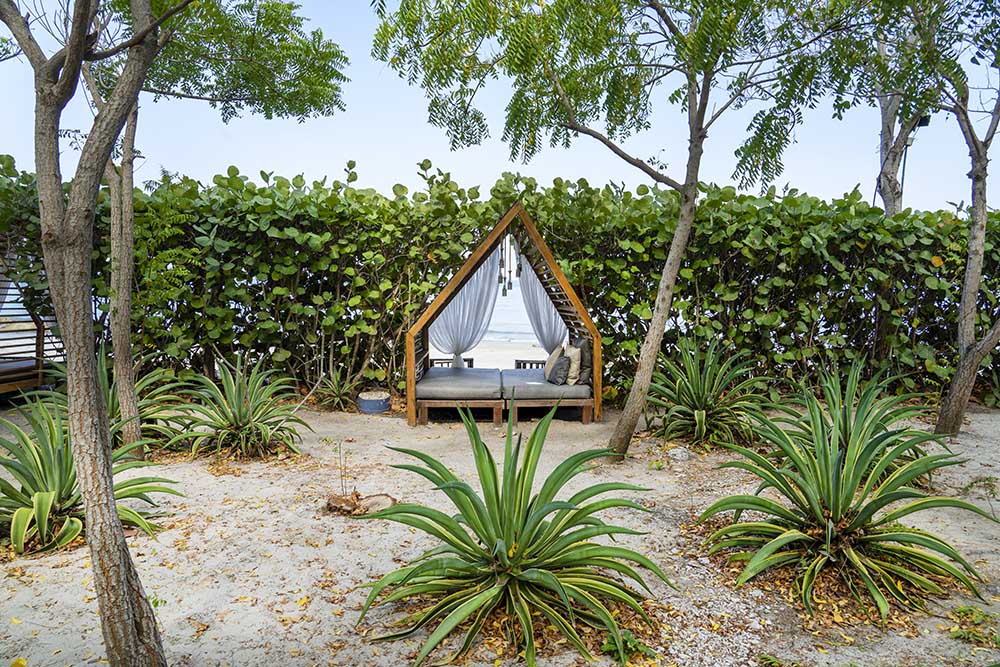 Blue Apple Beach Reserve a day bed overlooking the ocean for privacy