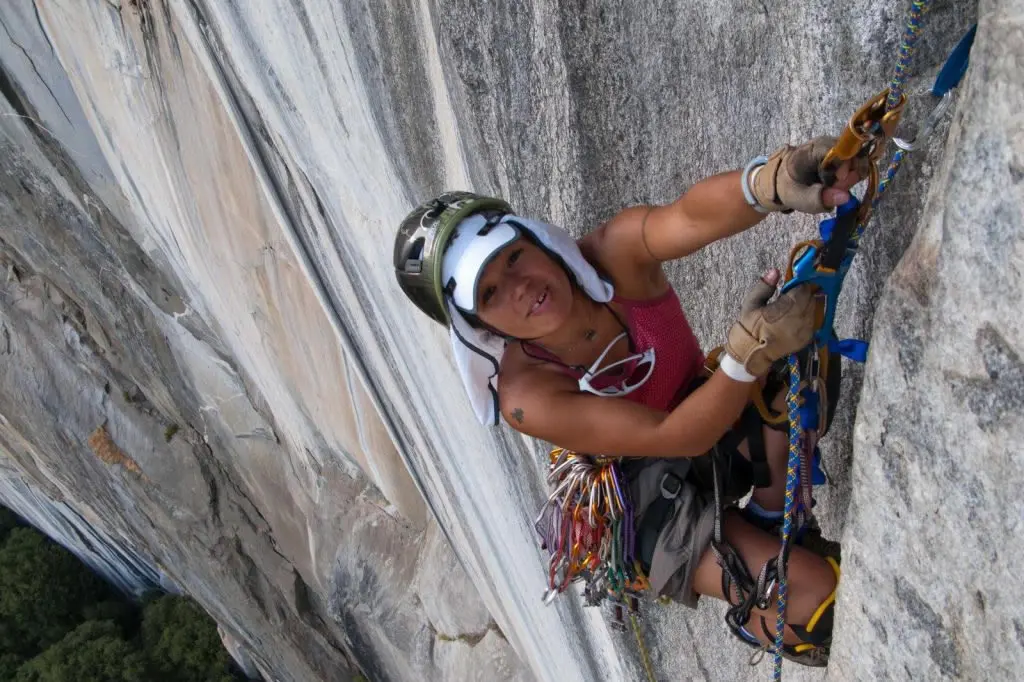 Chef Maria Hines scaling a cliff’s edge. Photo by Dan Nordstrom