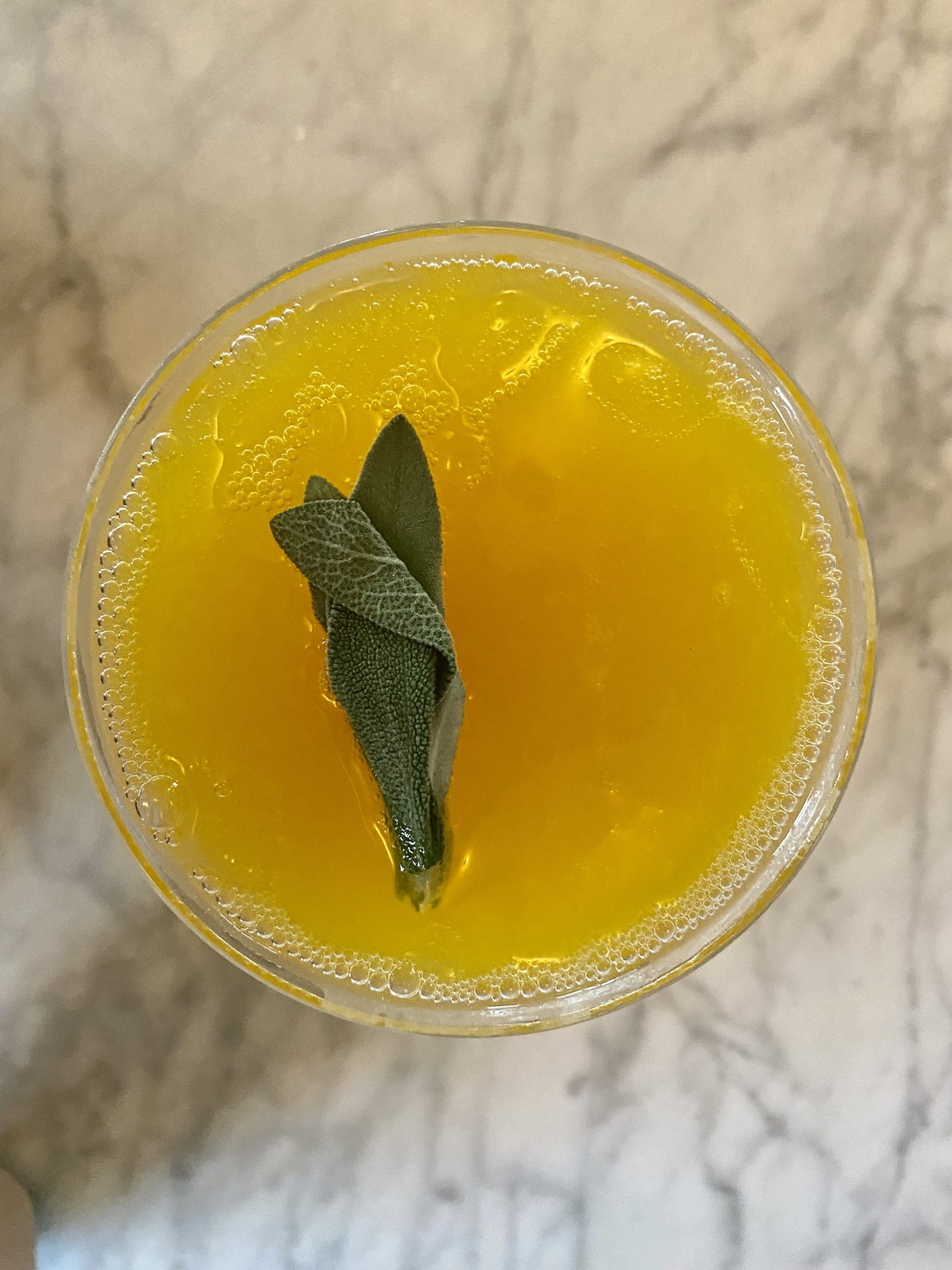 The Sage Lady (Mango infused vodka, mango nectar, peach bitters and sage leaves) 