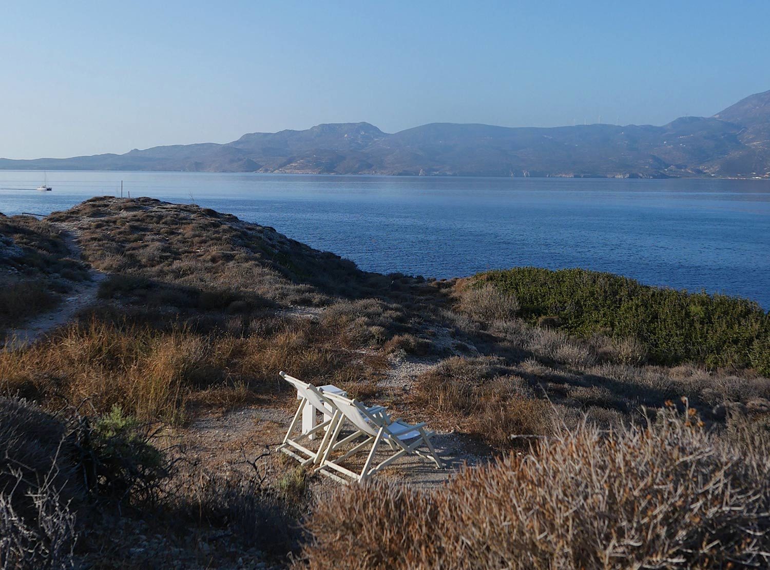 Skinopi Lodge A short walk from our villa to the cliff's edge are deck chairs to sit and take in the views