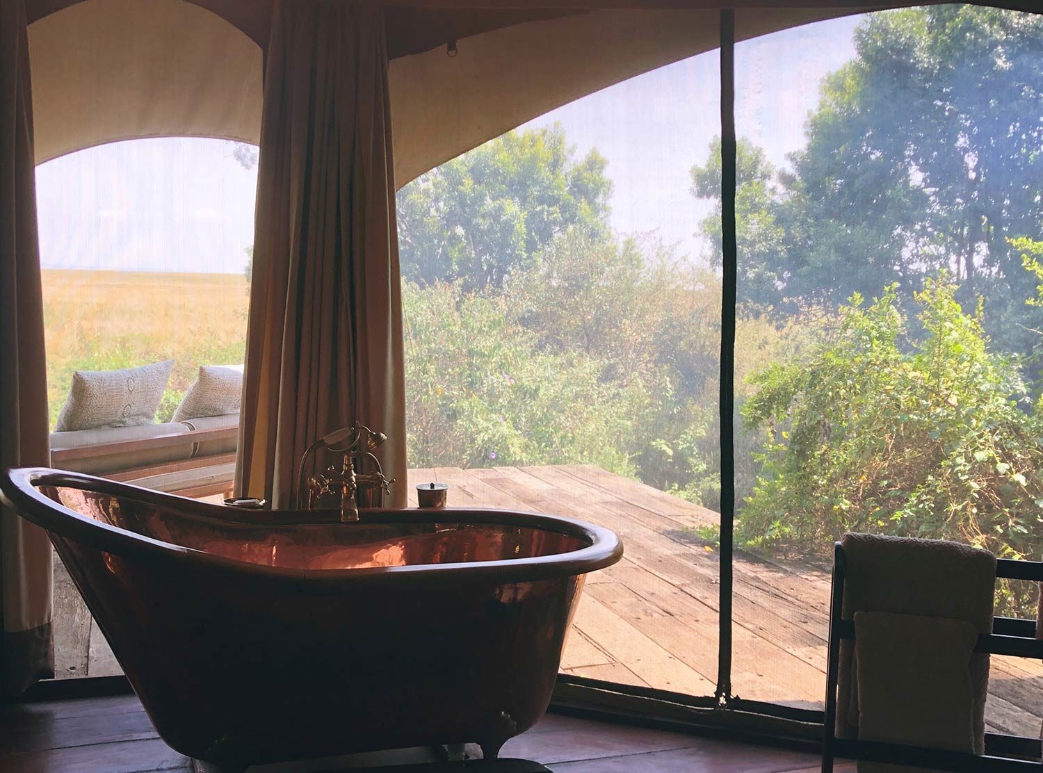 Mara Plains Camp Taking a bath when you can hear the hippos bathing in the river below.