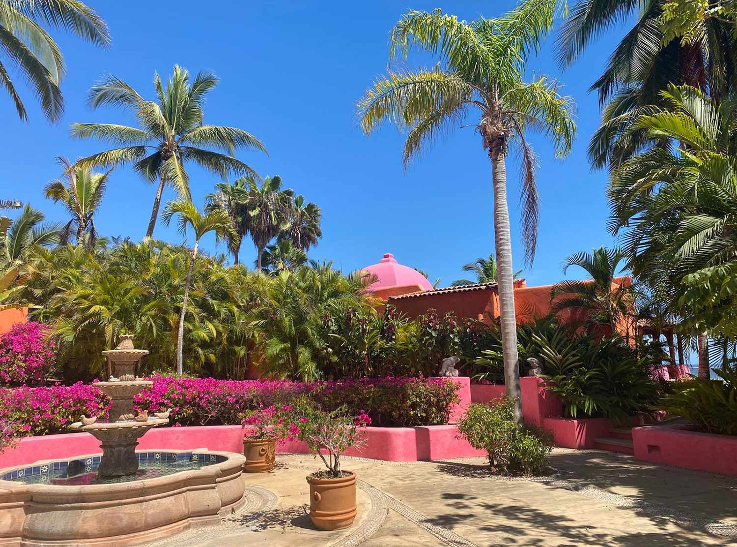 Las Alamandas Plaza Delfines decorated with bougainvillea and palms