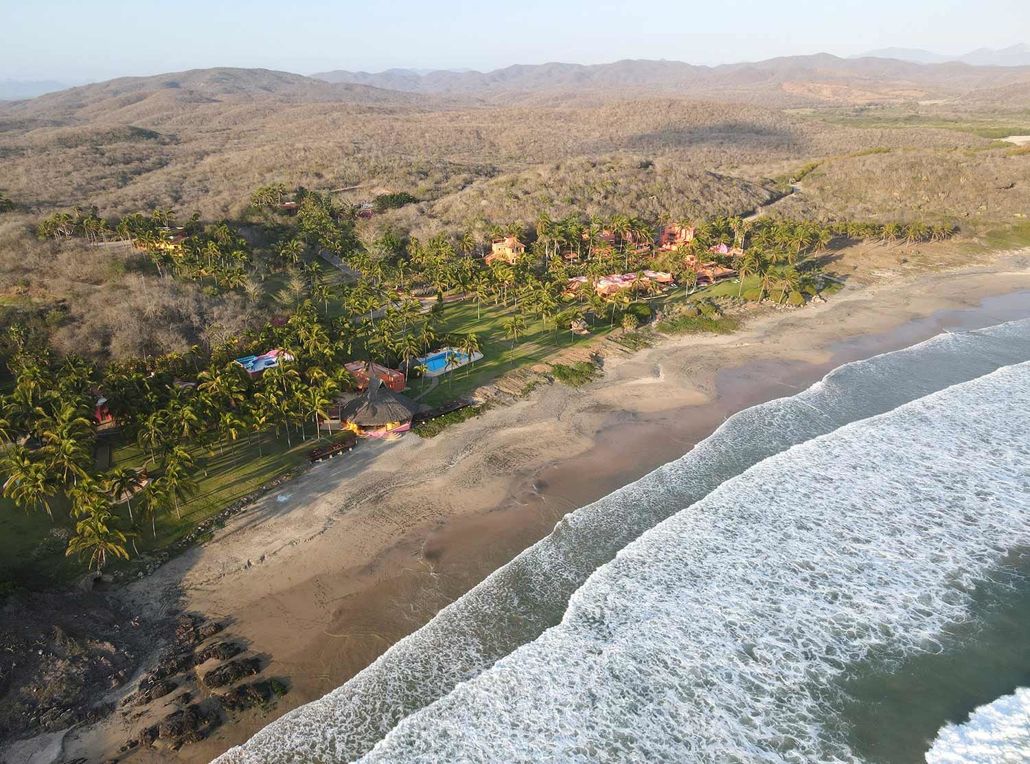 Las Alamandas Aerial view of the colourful beachfront property