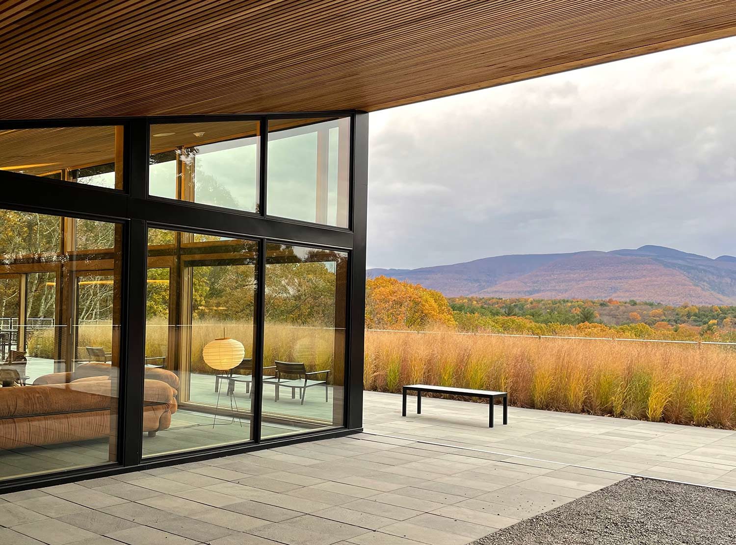 Piaule The lobby with its massive windows letting in all the various hues of surrounding nature