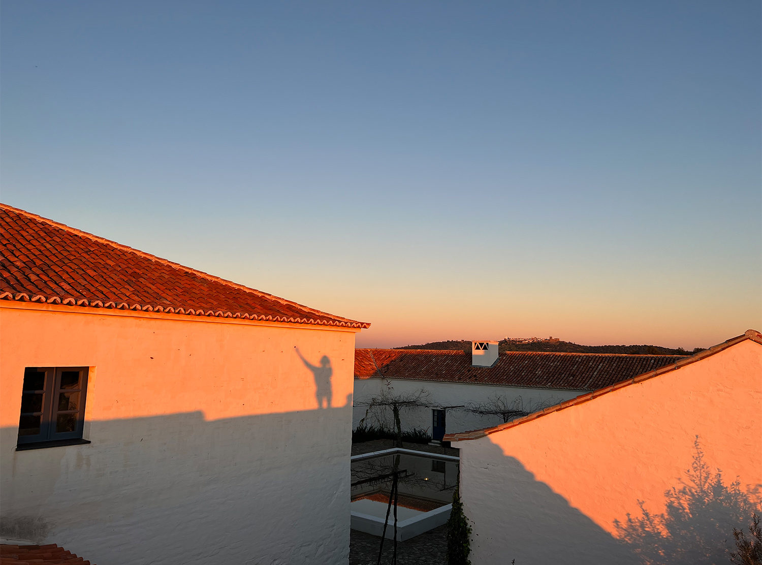 São Lourenço do Barrocal As the sun sets on the wide open plains, you can see on the hill top the white-washed medieval village of Monsaraz, sitting above