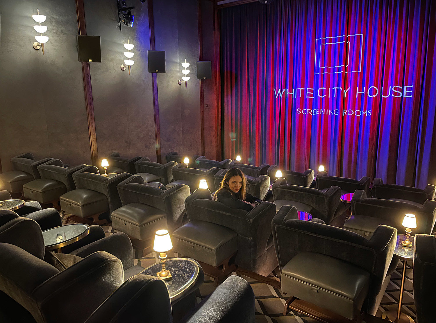 White City House Electric Cinema, one of the best designed movie theaters with velvet lounge chairs, mirrored side tables and a bar at your disposal throughout the showing