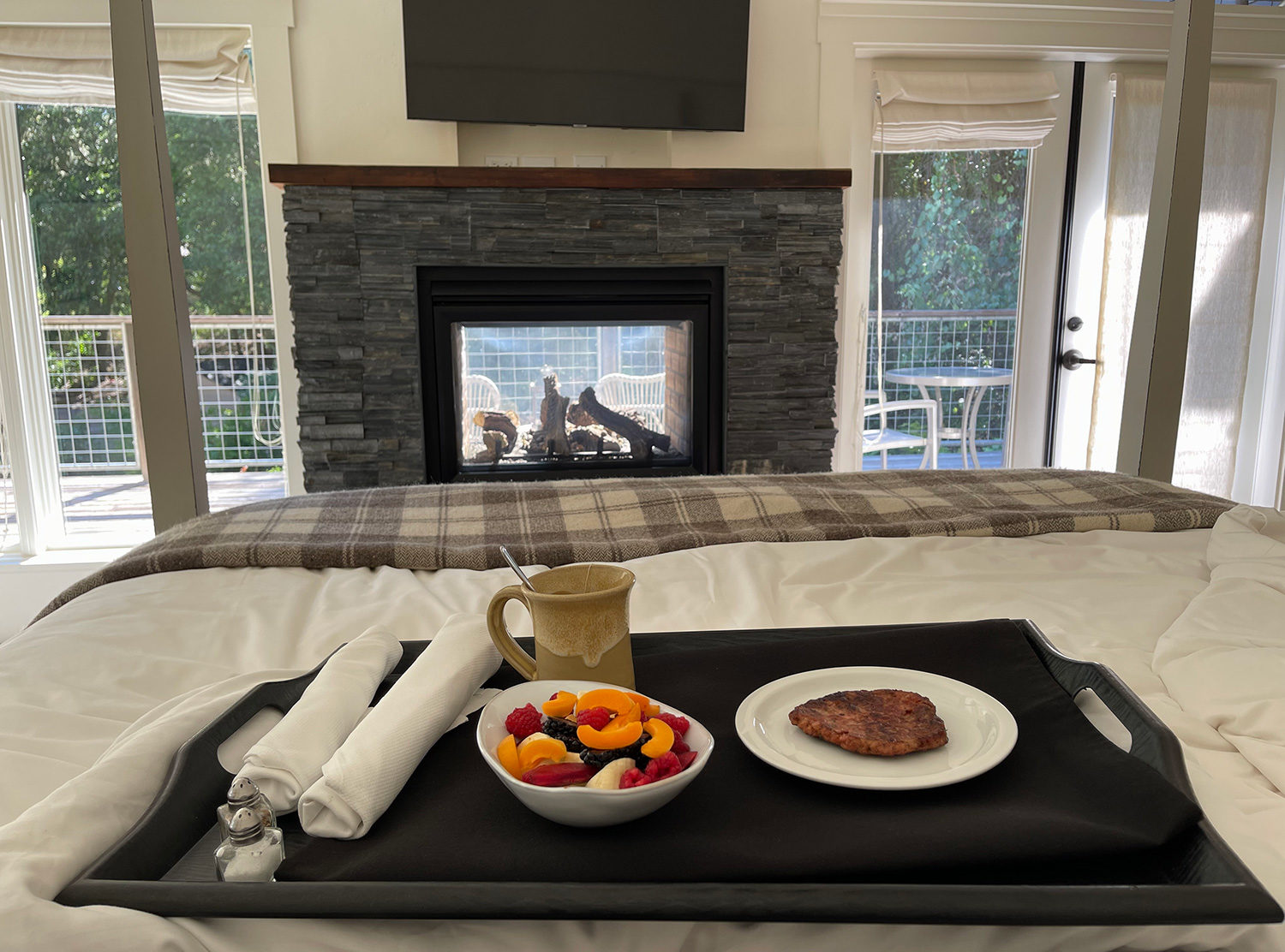 Farmhouse Inn A morning snack and as much time as possible in this cozy bed. Also, this two-way fireplace is everything!