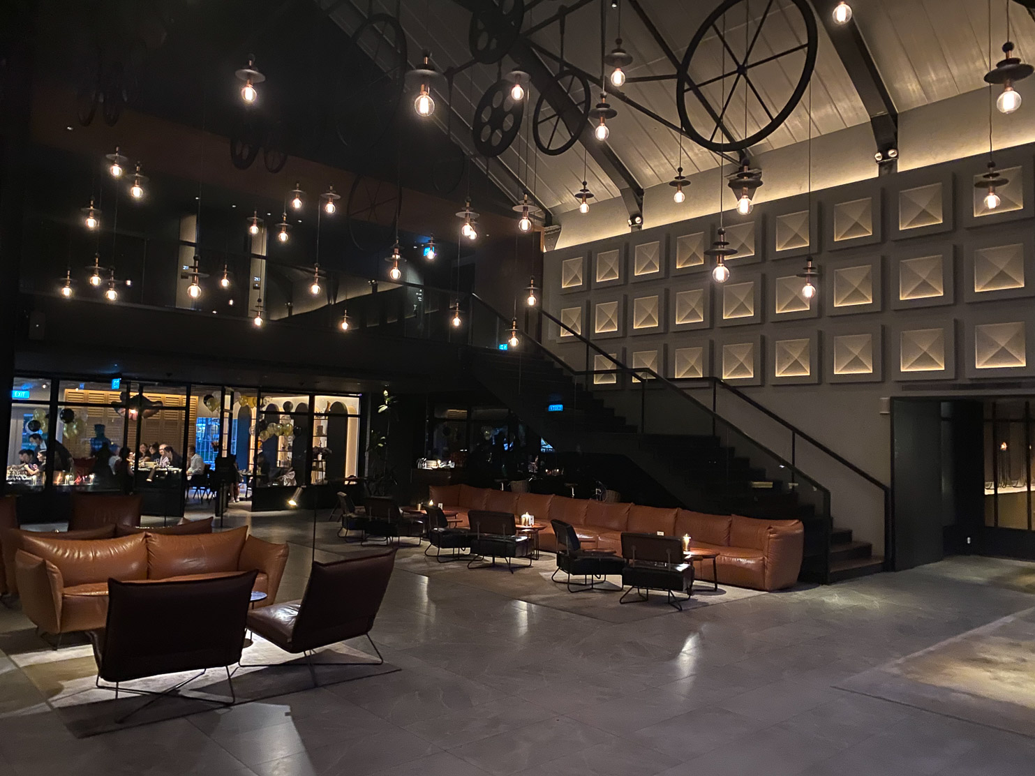 Warehouse Hotel The lobby is grand and inviting with industrial elements