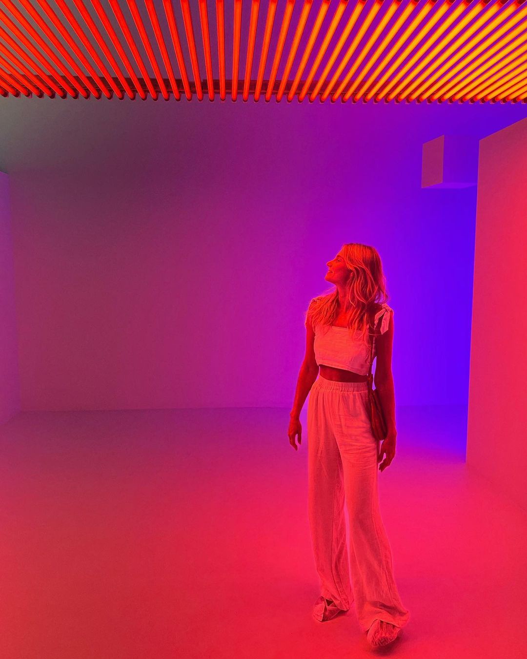Visitors interacting with Carlos Cruz-Diez' in 'Chromosaturation' at Pérez Art Museum Miami