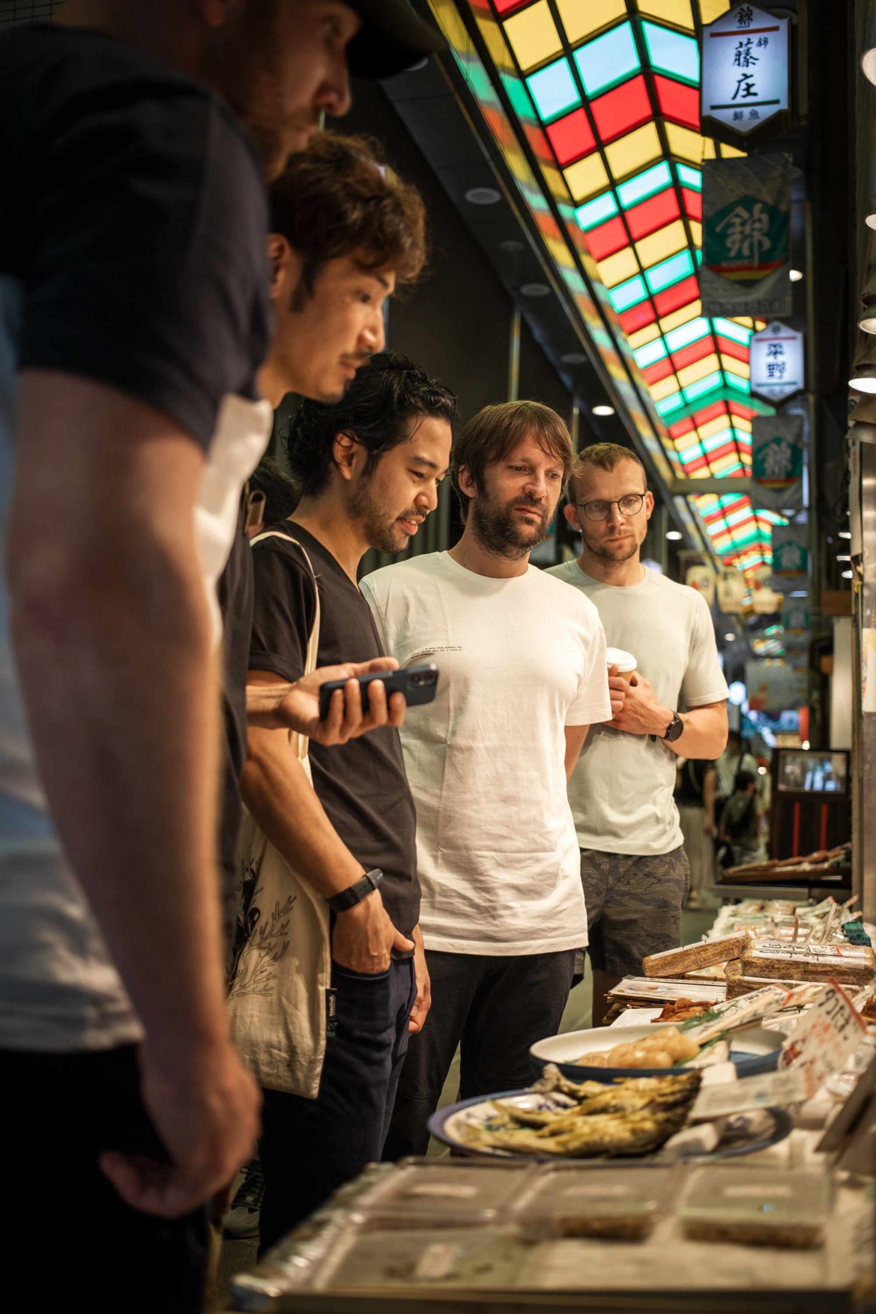 Chef Renè and the noma team researching hyper-local ingredients in Kyoto market. Photo by Amy Tang