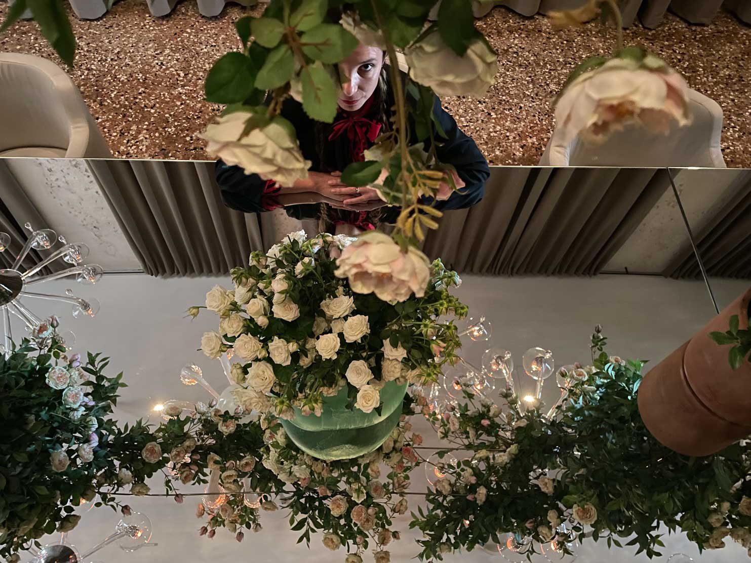 The Venice Venice Hotel A mirrored table that sits 60 people and reflects an installation with original Murano chandeliers and hundreds of roses, creating a whimsical floating garden 