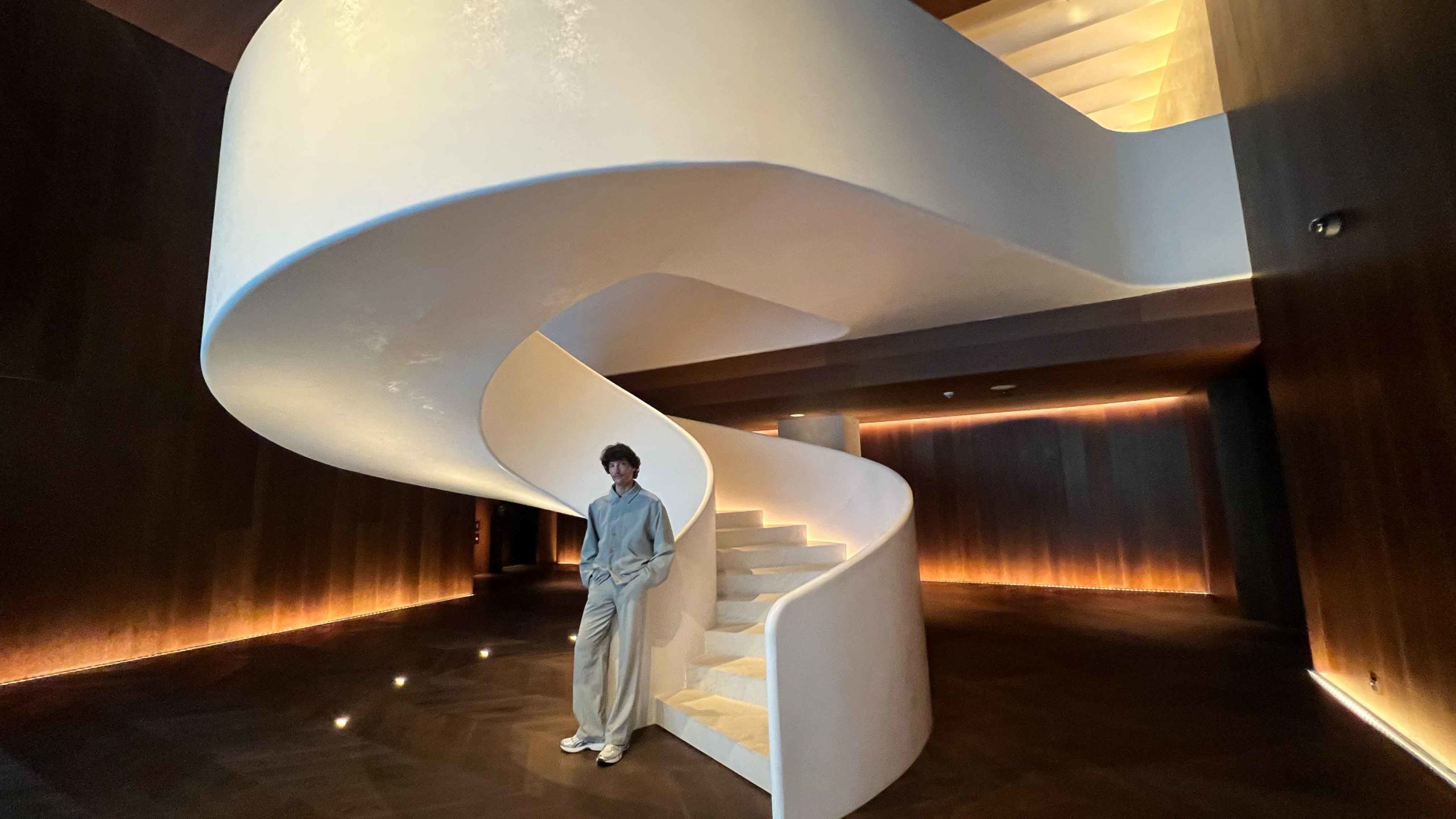 Alex Sez de Mora striking that pose at EDITION’s iconic sleek sculptural staircase