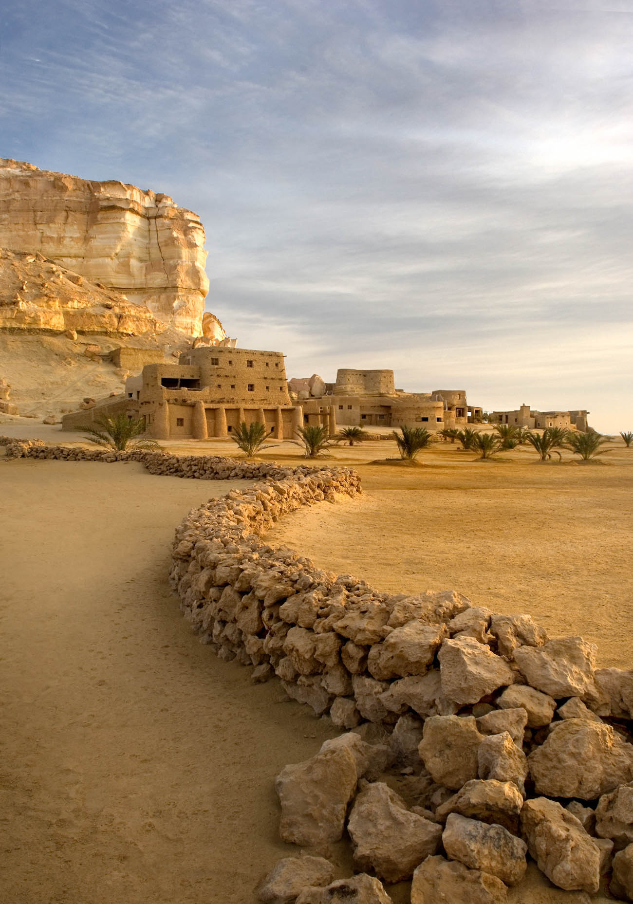 A giant sand castle of a hotel in a desert oasis