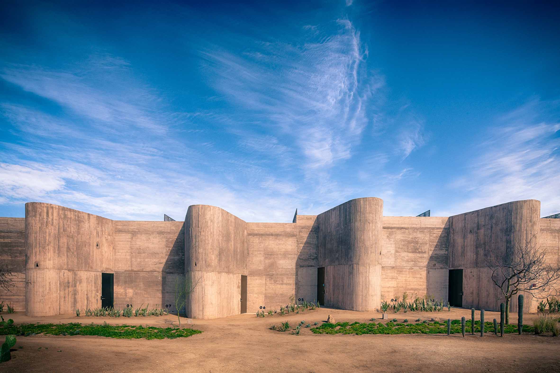 A sight that takes your breath away. The brutalist structure of Paradero emerges from the desert