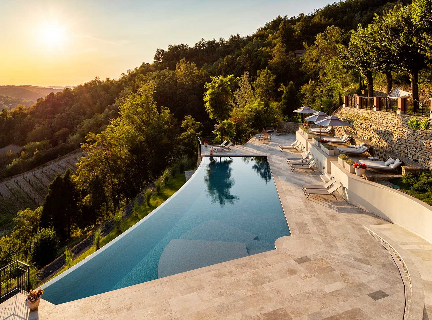 Nordelaia The summer pool with the vineyard below where the grapes for the house Calligram are harvested