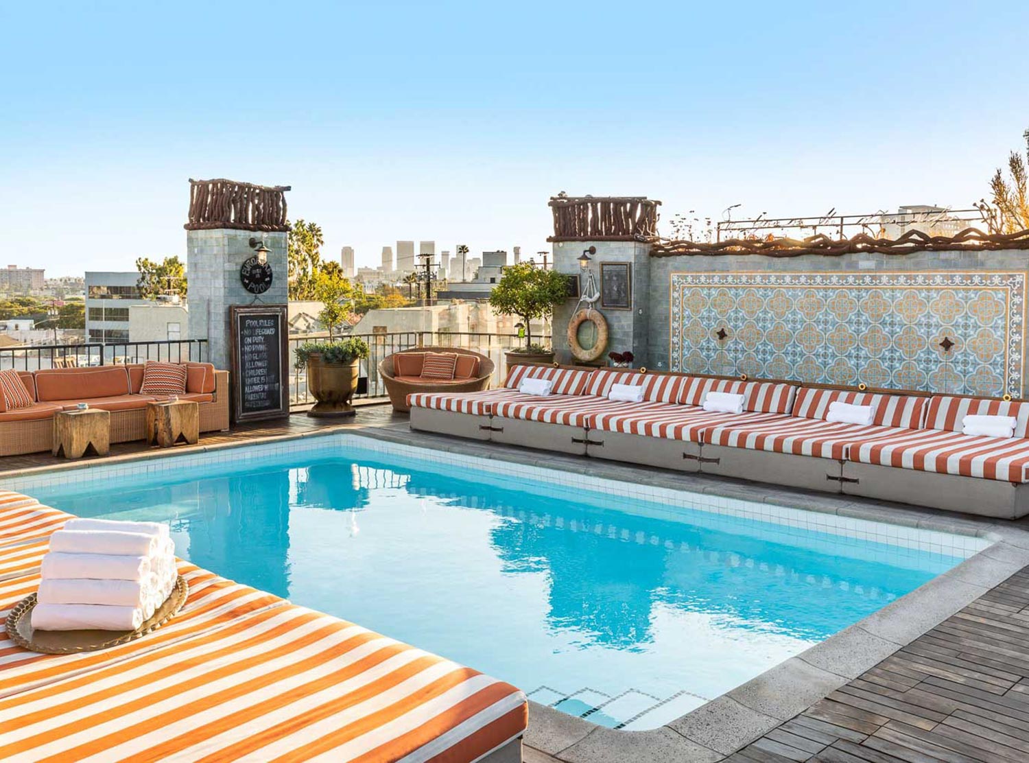 The roof deck with pool and outdoor fireplace is one of the coolest hangs in all of LA