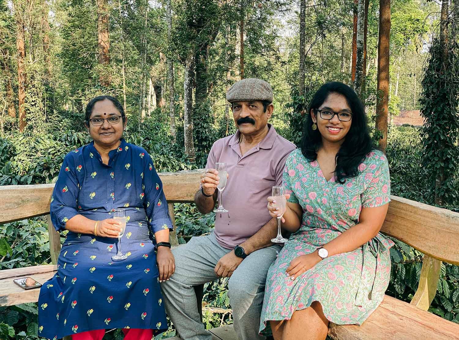 Evolve Back, Coorg Drinking lemonade with the family on a deck that offers 360º views of the estate