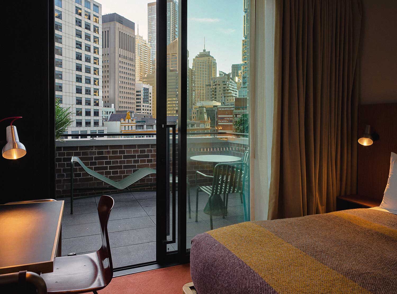Ace Hotel Sydney Comfortable room and the arresting skyline beyond