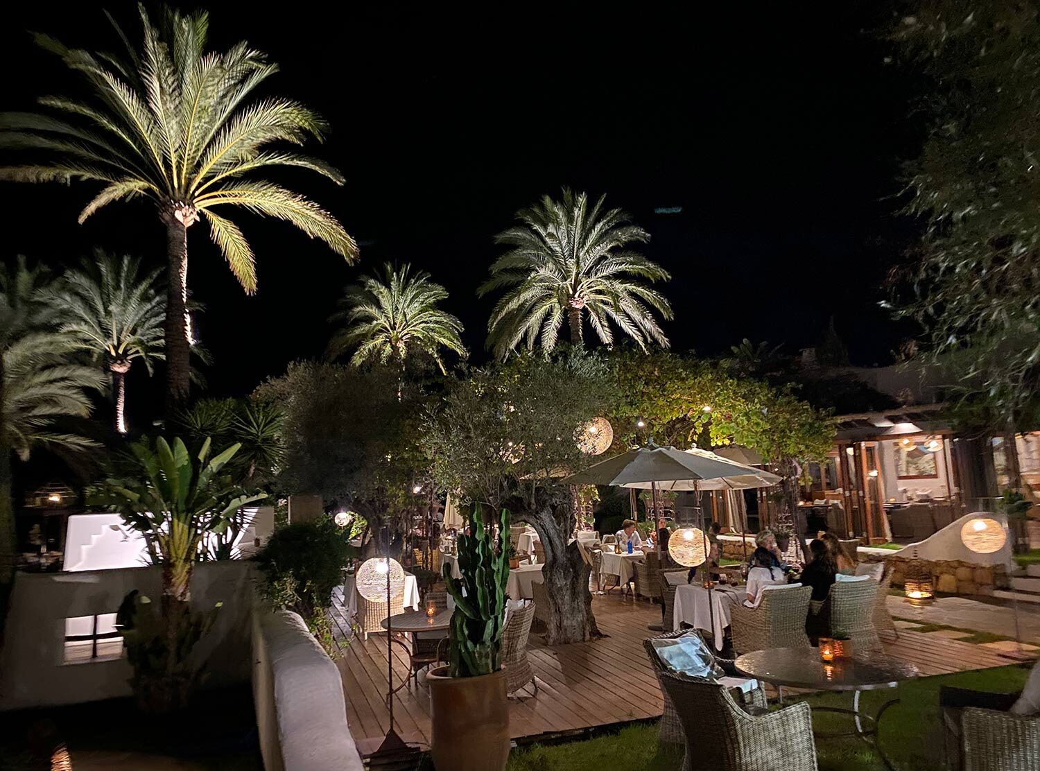 Atzaró Agroturismo Hotel The gardens and common spaces at night. There's a robust program of activations throughout the summer