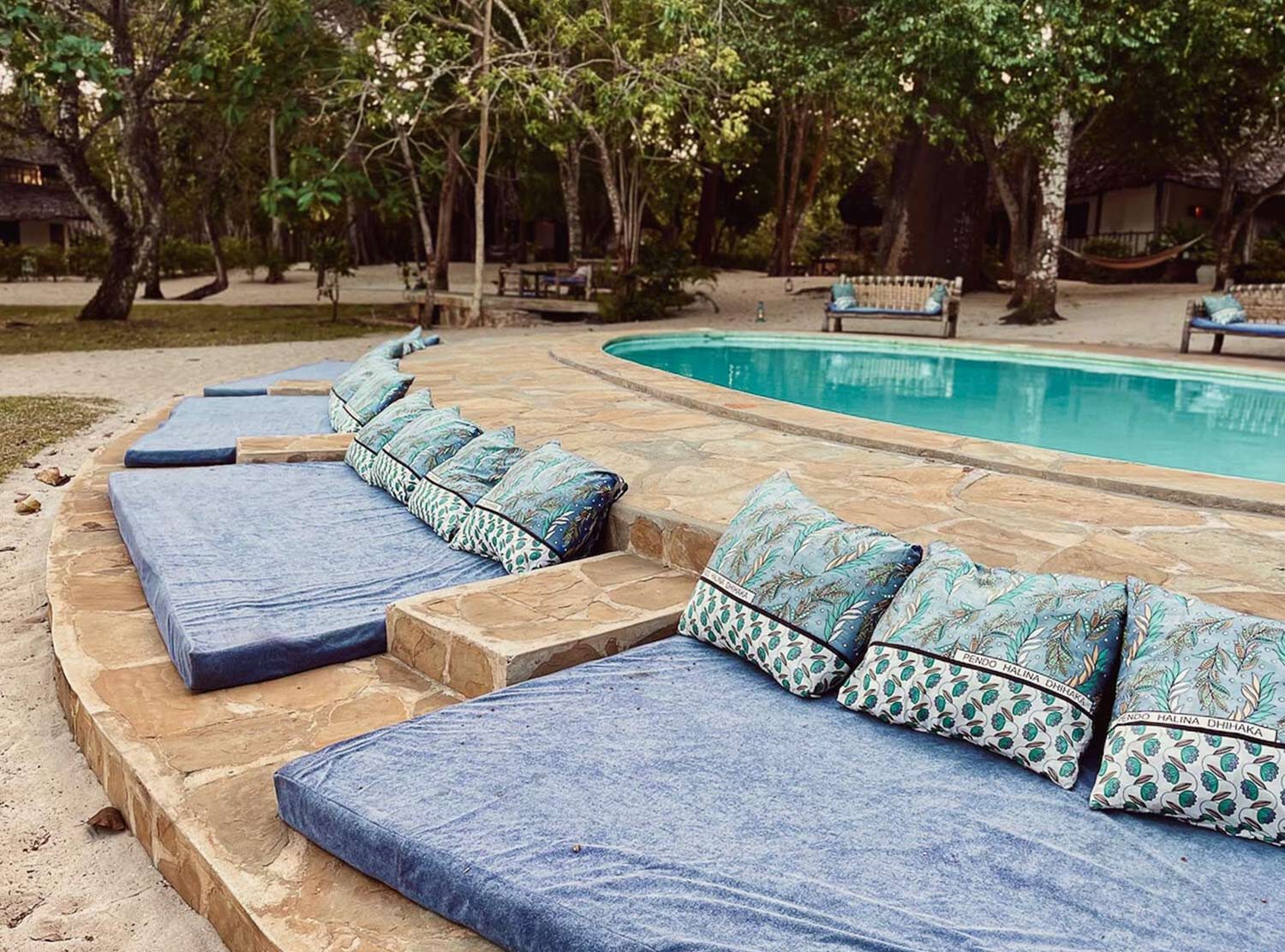 Kinondo Kwetu One of two beautiful pools on the 16 acre property. All the cushions are custom made with Kenyan fabrics