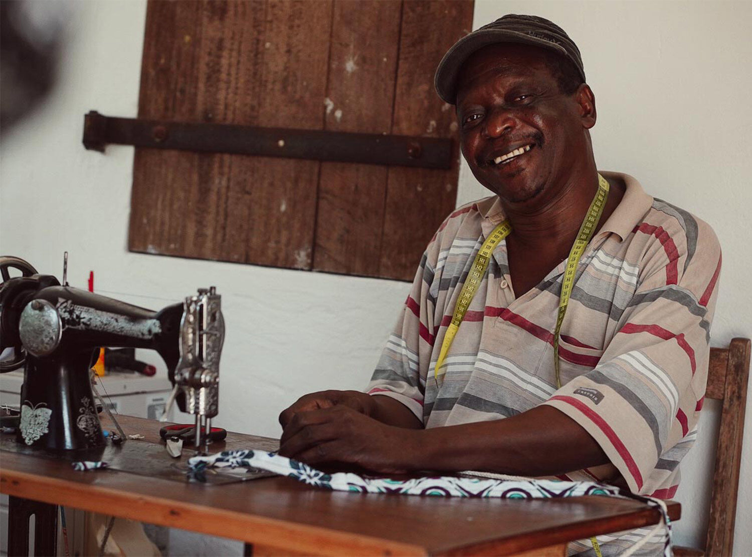 Kinondo Kwetu Kinondo's tailor making us a custom shirt in one of the hotel's signature fabrics