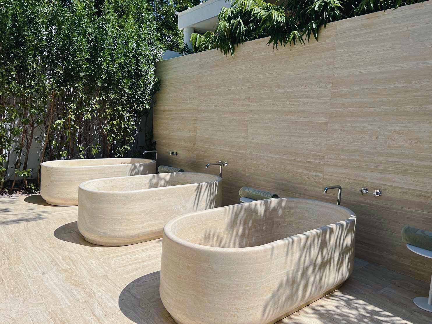 Palm Heights Be immersed in nature with these soaking tubs built from travertine stone at the spa