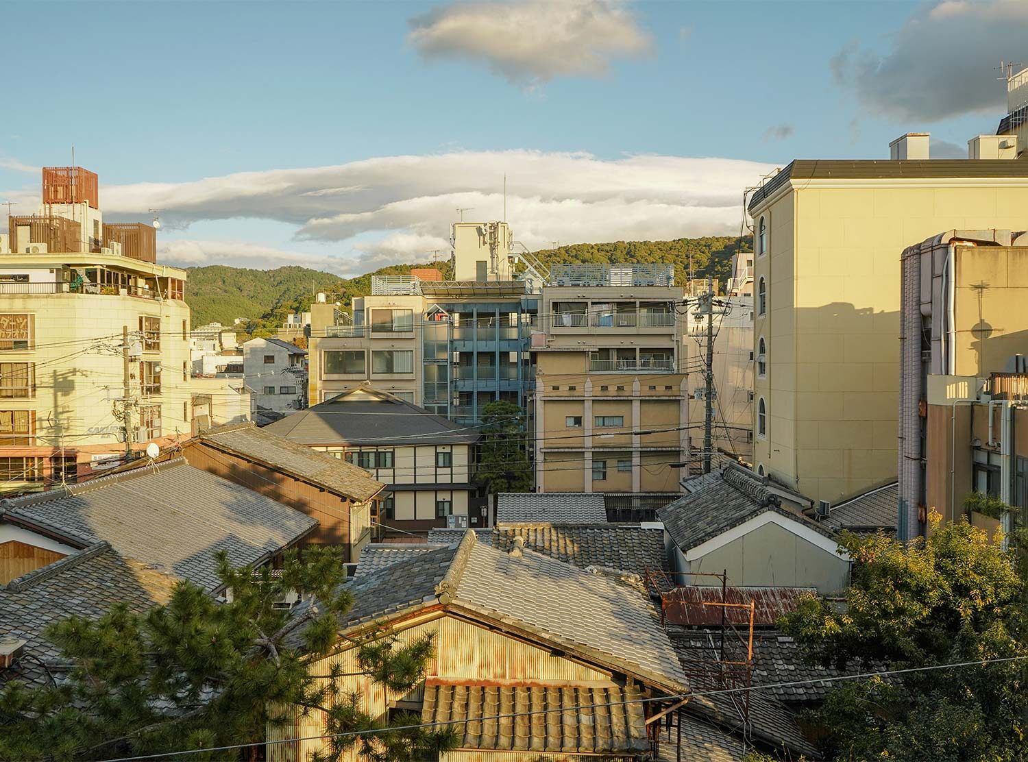 The Shinmonzen Golden hour light washing over the historical Gion District from our terrace