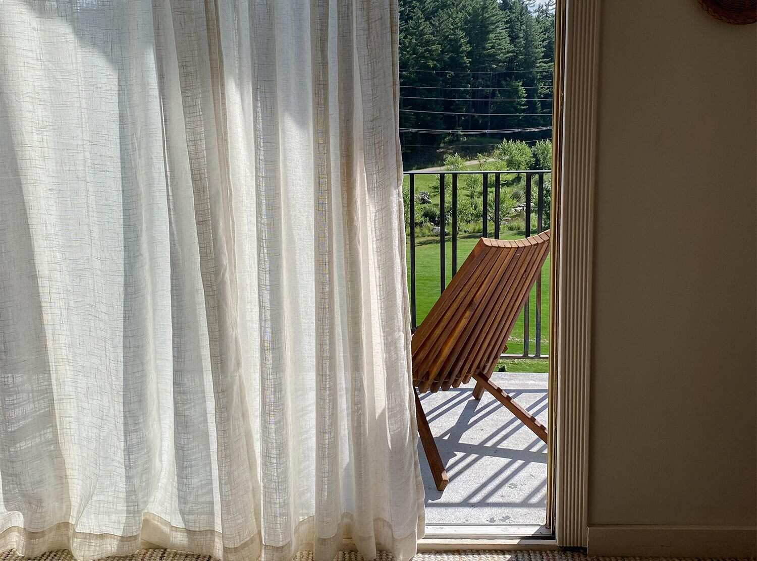 Eastwind Hotel Lake Placid Minimalist wooden lounge chairs let nature steal the show