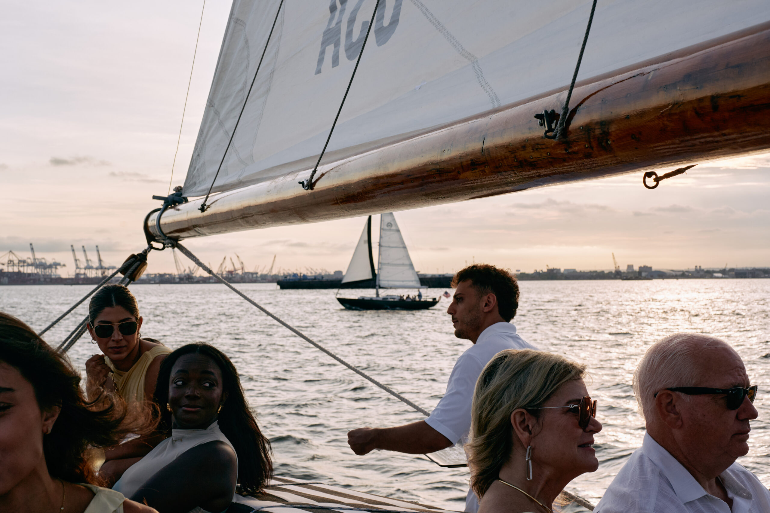 The harbor is filled with classic sailboats.