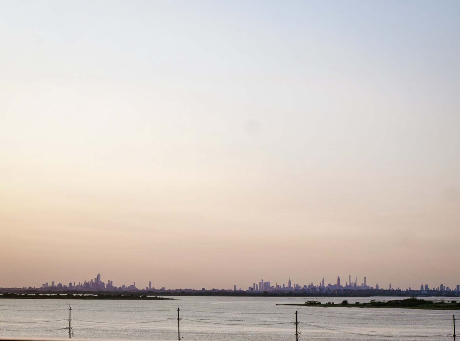 The Rockaway Hotel an unusual perspective of the Manhattan skyline, where the distance clearly separates Downtown from Midtown.