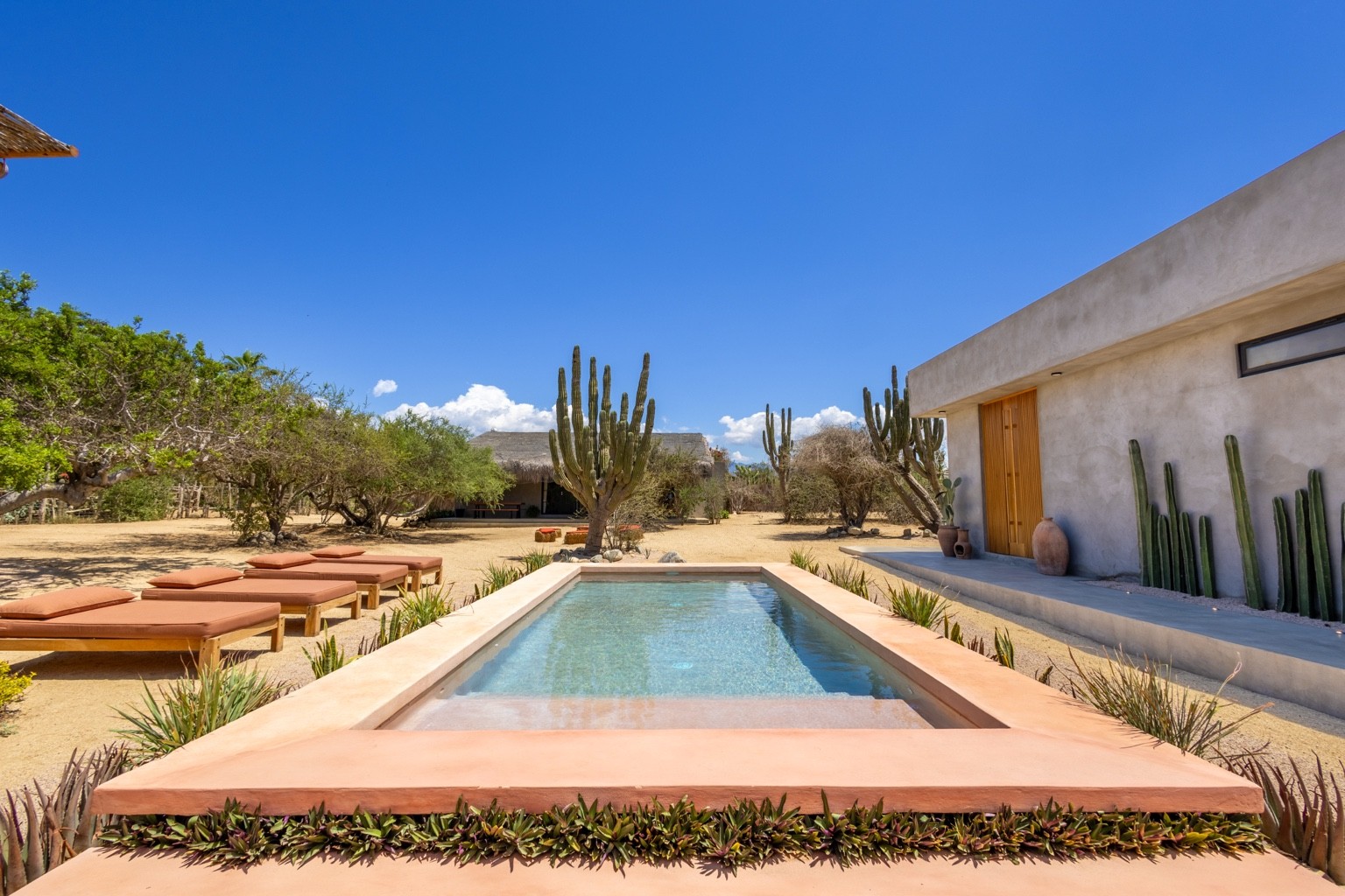 The chukum-tinted pink pool is a striking, welcoming feature at the heart of Casa de Zorros