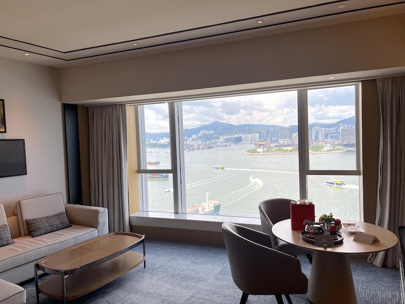Four Seasons Hotel Hong Kong Stepping off the elevator, I was instantly greeted with stunning skyline views on my way to my room.