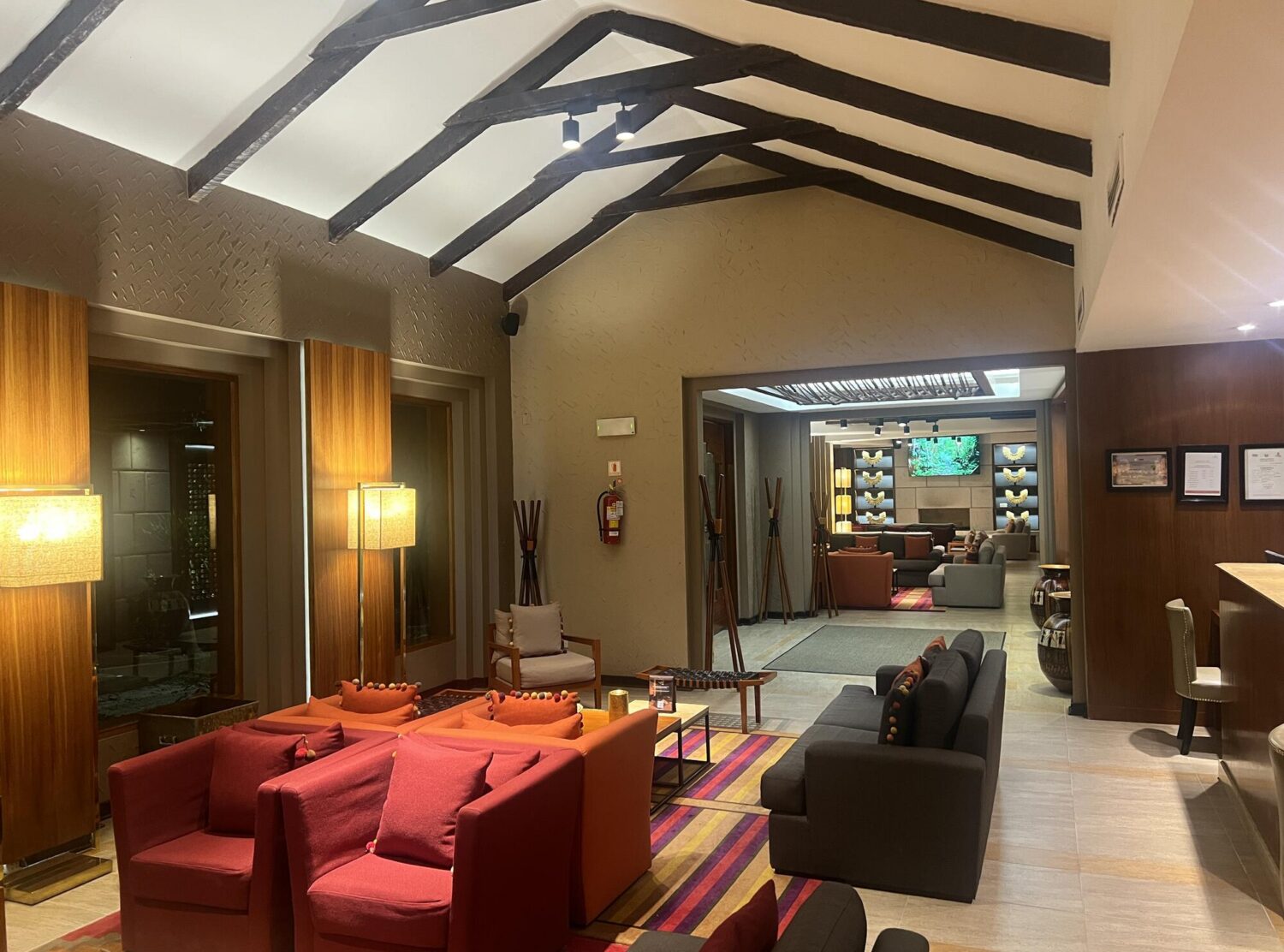 Sumaq Machu Picchu Hotel The lobby set the tone immediately. Wood beams, bold Andean textiles and artwork, glowing lamps at every turn