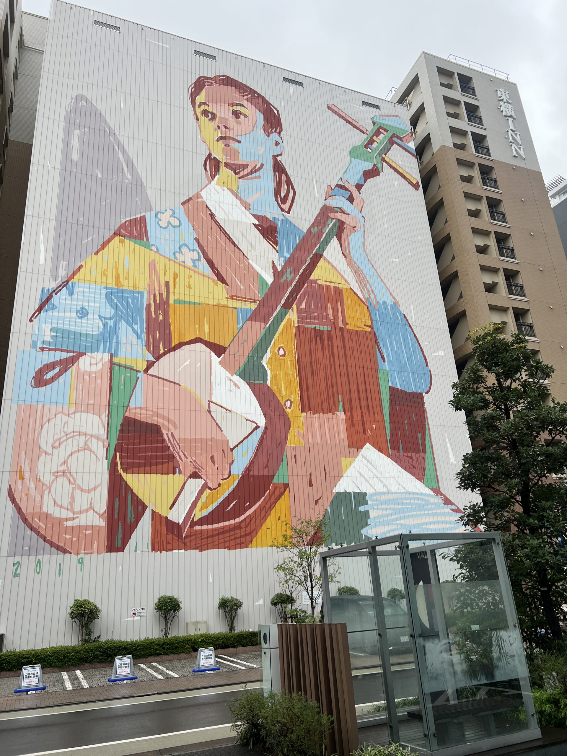 Muralist and street artist ARYZ’s towering “The Shamisen