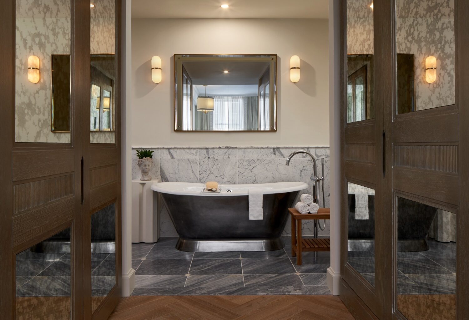The Wall Street Hotel Elegant marble, heated floors and a free standing bathtub making the case for a night in.